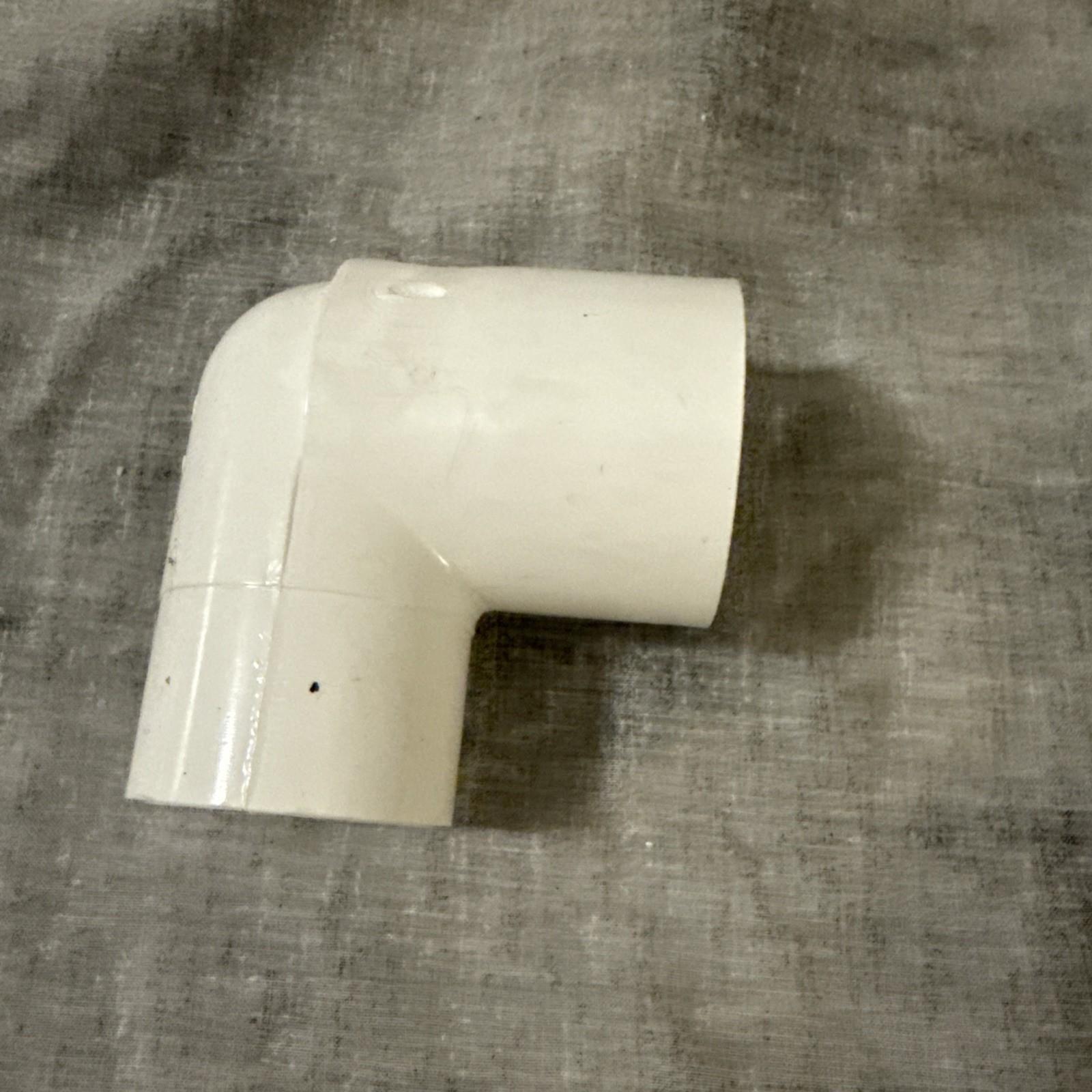 1 1/2" Charlotte 409-015 PVC 2304 Series 90° Street Elbow, SPG x Sfc