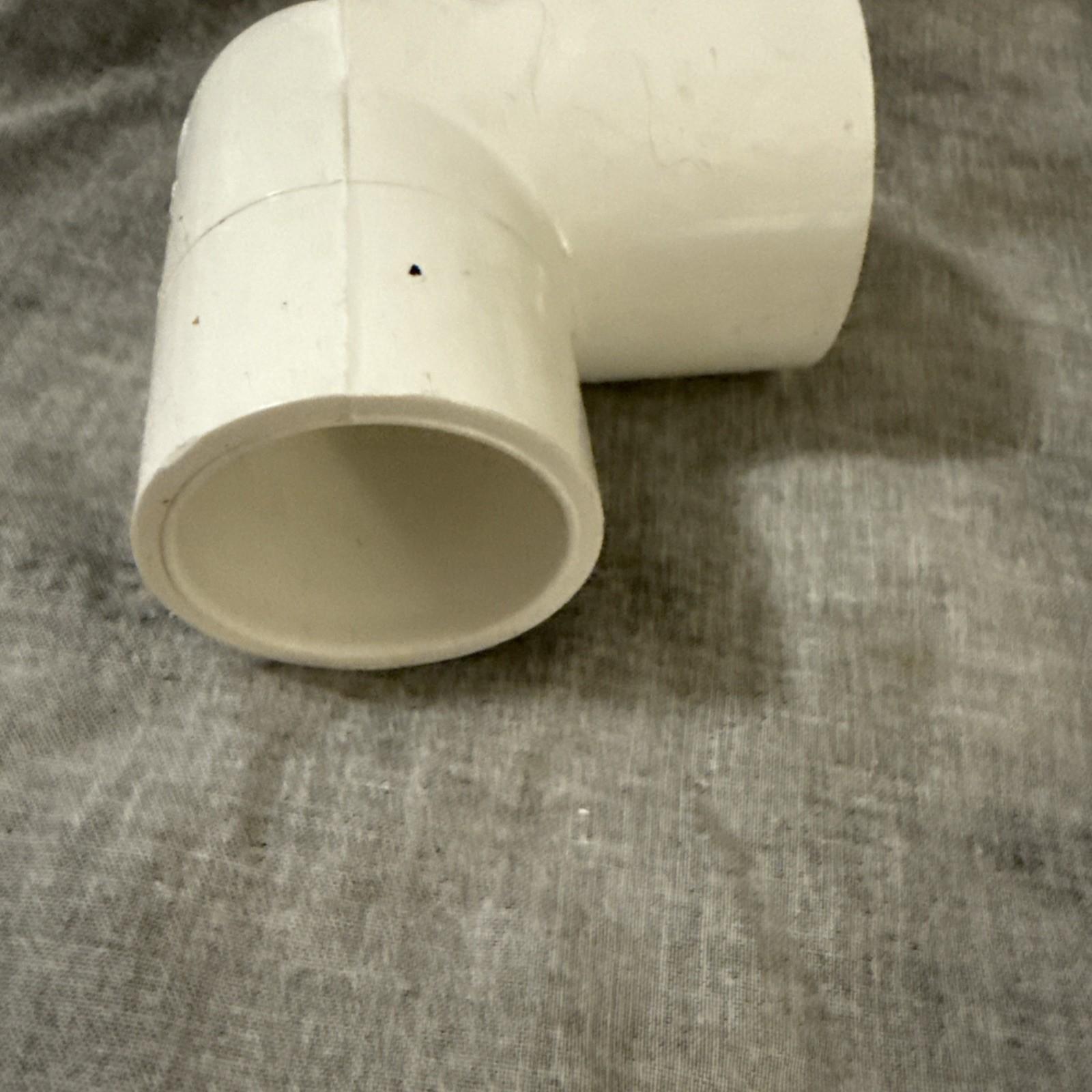 1 1/2" Charlotte 409-015 PVC 2304 Series 90° Street Elbow, SPG x Sfc